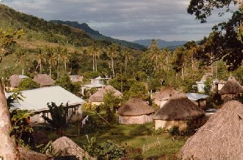 The houses are close together in the village, with farms surrounding.