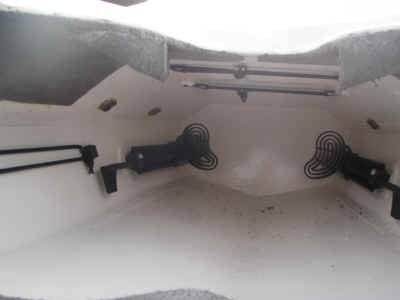 Inside outfitting showing sponge storage shock cord on the left, and two shock cord loops on the underside of the deck for pump storage. 