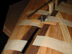 clamps, tape, wedges... whatever...